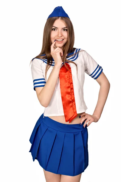 Girl in costume sailors. The blue skirt, white shirt, red tie, forage cap. Photo on a white background. Stock Image