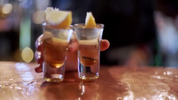 Bartenders hand is giving out the shots — Stock Video