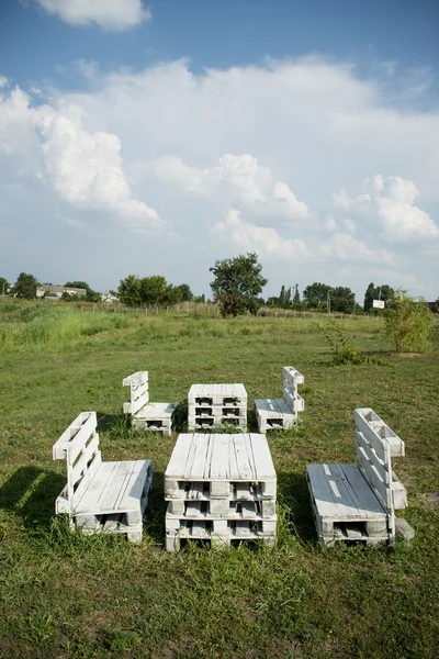 white furniture from pallets on the green grass