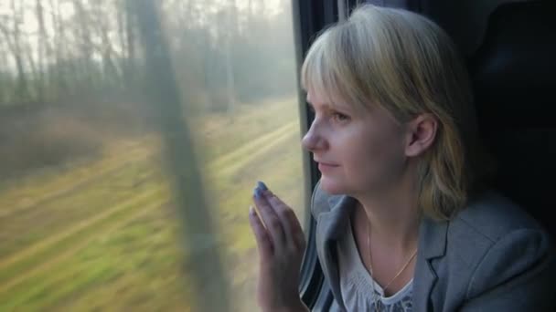 Dreams and journey, a woman traveling in a train — Stock Video