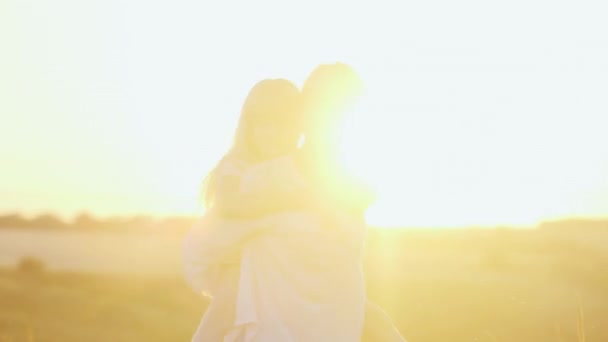 Family fun - mother playing with her daughter, laughing. The setting sun — Stock Video