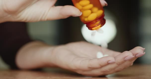 Womens hands pour pills on their palm — 图库视频影像