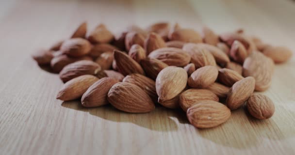 Almond grains fall on a pile. Slow motion 4k video — Stock Video