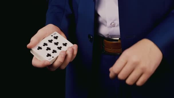 Young magician show a trick with cards Video Clip