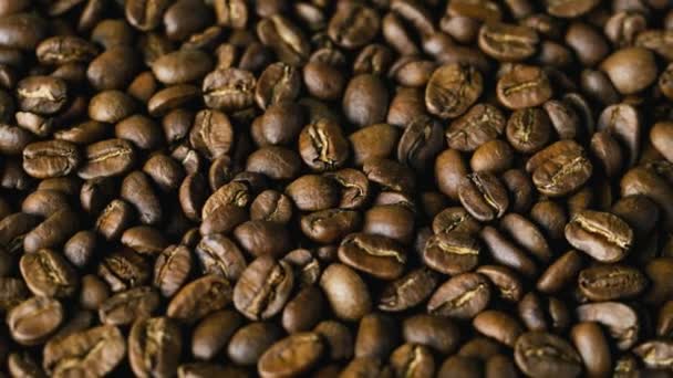 Granos de café marrón, granos de café de fondo y textura — Vídeo de stock