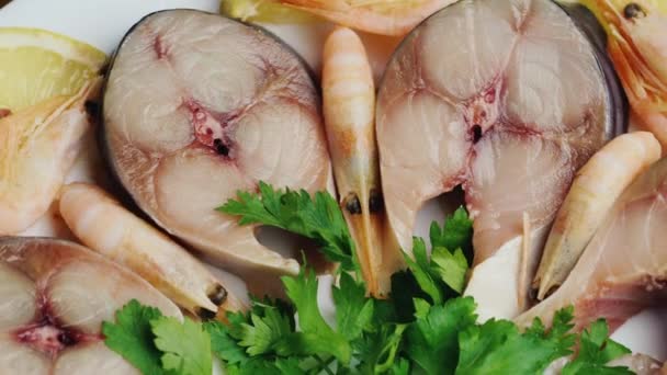 Appetizing pieces of fish with herbs and lemon — Stock Video