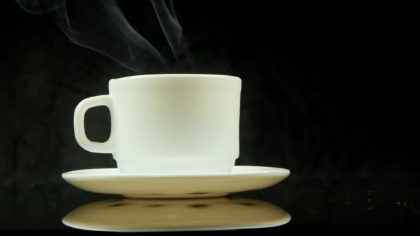 A cup of hot coffee with steam