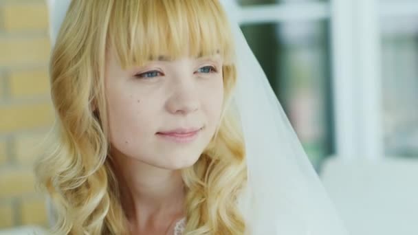 Portrait of blond bride who looks in the mirror — Stock Video