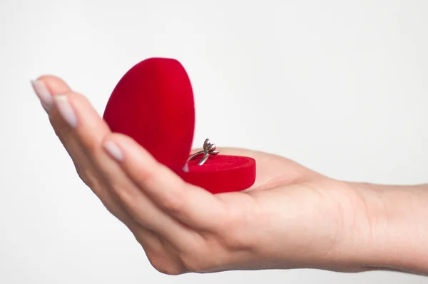 Gift box with a ring in hand — Stock Photo, Image