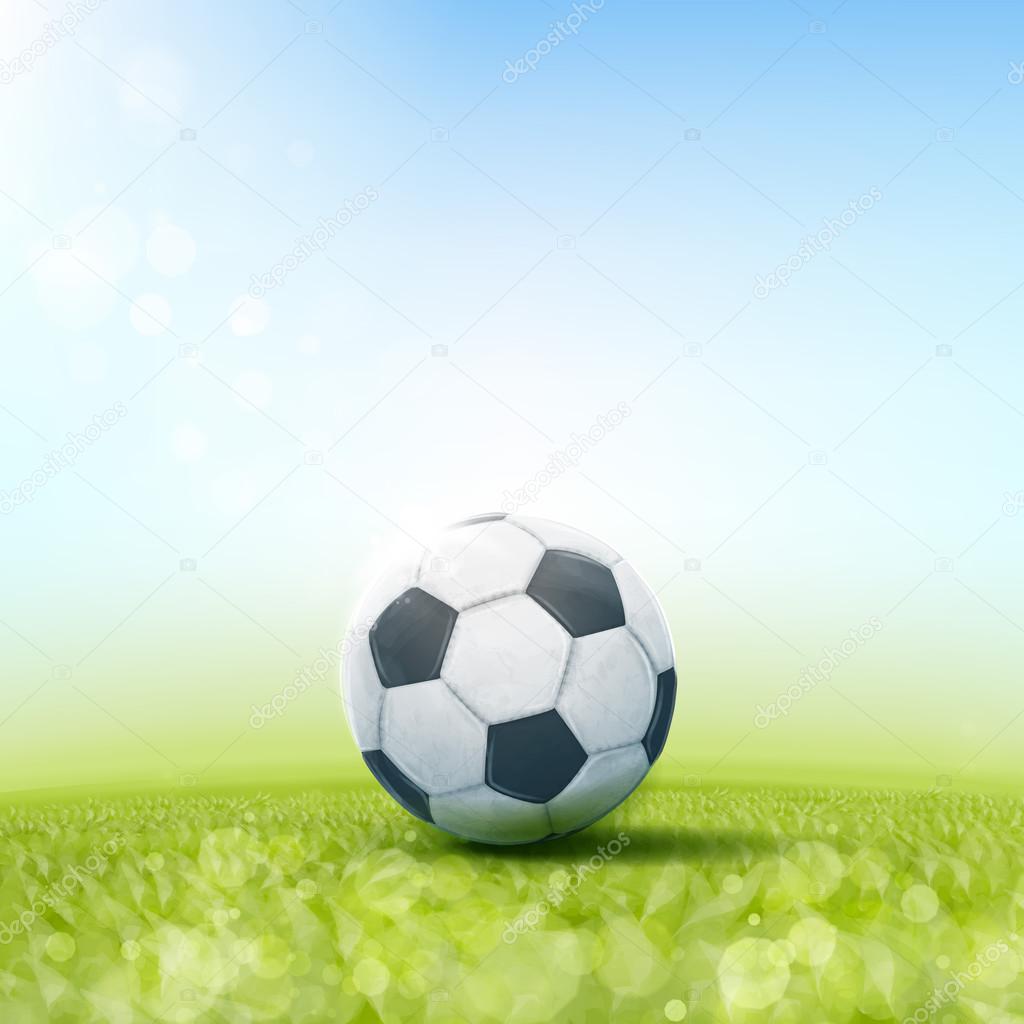 Soccer ball laying on grass field