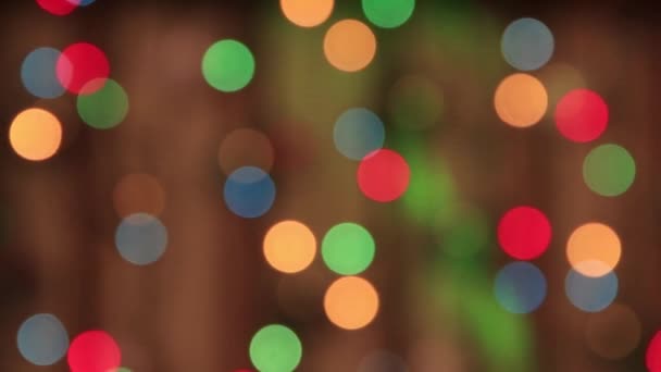 Festive rare multi-colored lights move in the dark with a slow green beam. — Stock Video