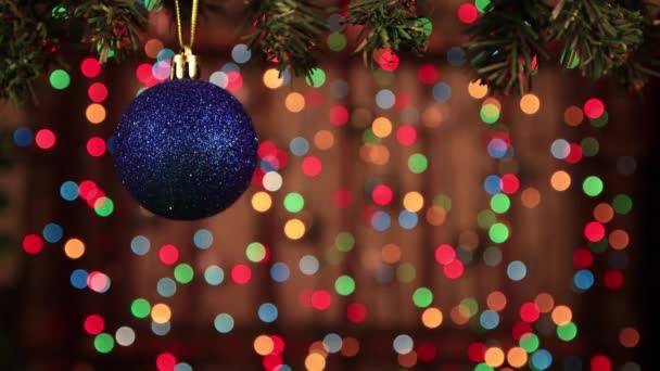 Decoration for the new year - a shiny blue ball close up. — Stock Video