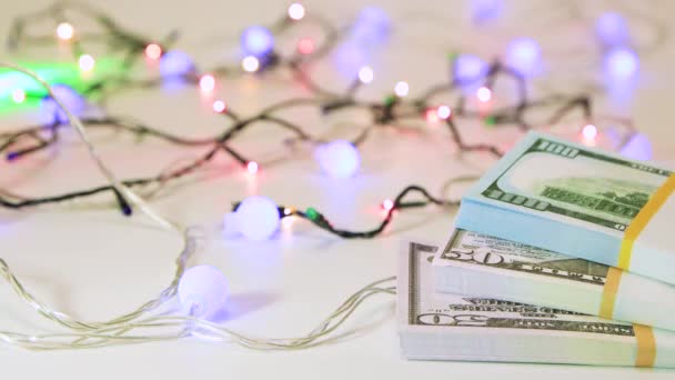 Dollars of different denominations, bundles of money with bokeh back. — Stockvideo