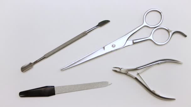 A man in close-up takes scissors, nippers, scraper and nail file. — Stock Video