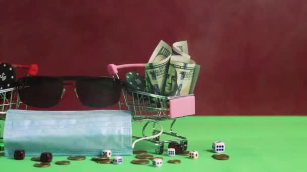 Close-up on a green gaming table baskets with bunktot of dollars and euros — Stock Video