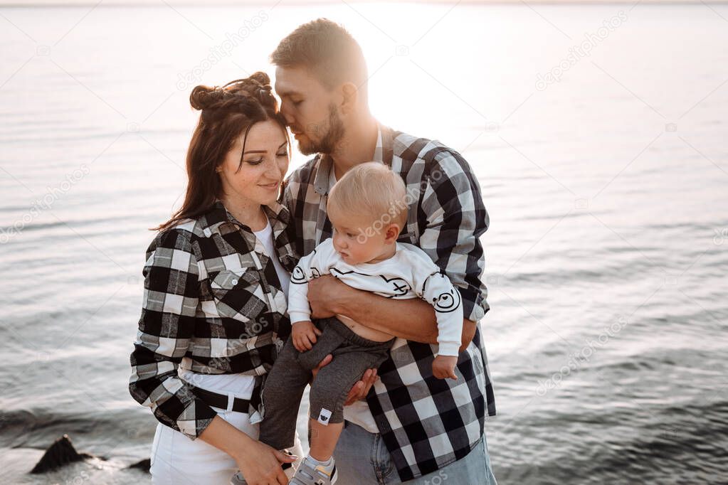 Happy young family together. Parents and their little child.
