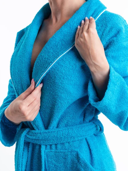 woman in a bright dressing gown advertises clothing details on an isolated white background. Taken in the Studio close-up.