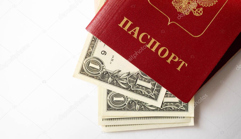 A foreign passport and dollars on a white isolated background. Photos of documents and banknotes.