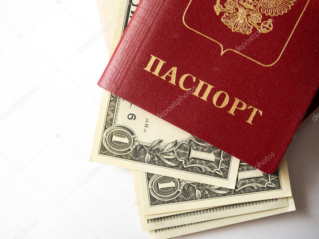A foreign passport and dollars on a white isolated background. Photos of documents and banknotes.