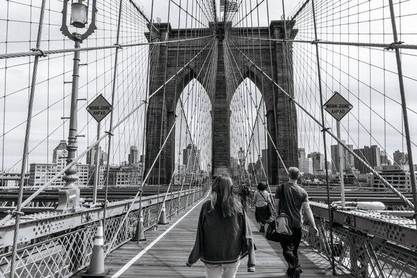 New York, USA - September 21, 2015: People on the Brooklyn bridge in New York.