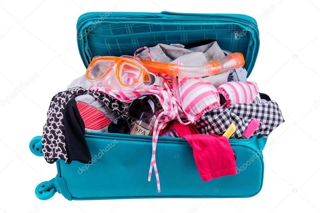 Packing to go on vacation isolated on white background