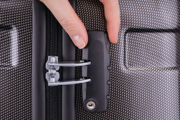 Hand opens suitcase combination lock — Stock Photo, Image