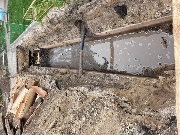trench with pipes, repair work on the water supply.