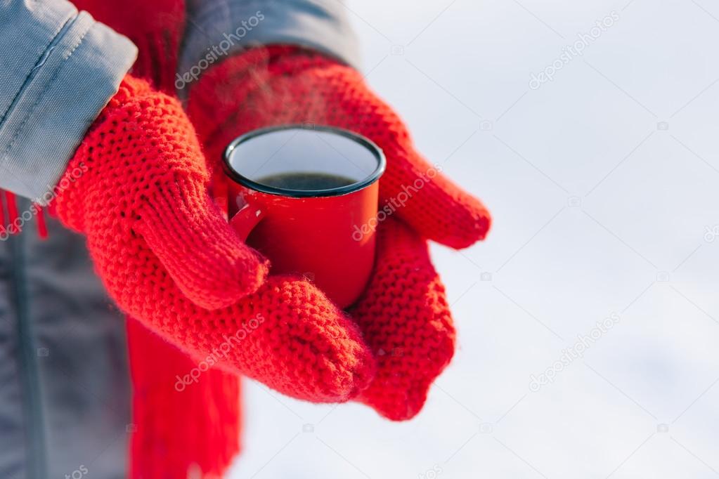 Woman holding winter cup close up