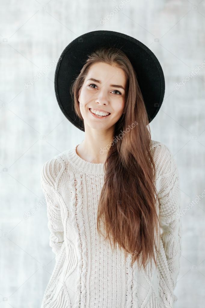Portrait of Trendy Hipster Girl in Red Hat, studio shot
