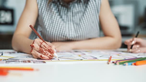 Cropped view of female architect drawing line on blueprint — Stock Video