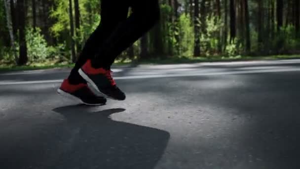 SLOW MOTION Closeup of man jogging and training for marathon. — Stock Video