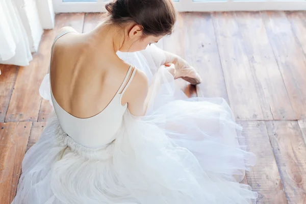 Beautiful ballerina, back view on wood background — Stock Photo, Image