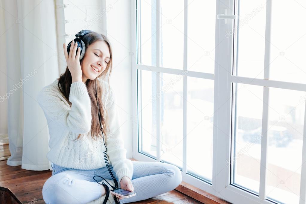 woman listening music with headphones. relax and unwind