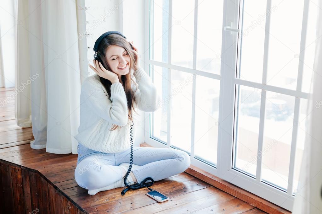 woman listening music with headphones. relax and unwind