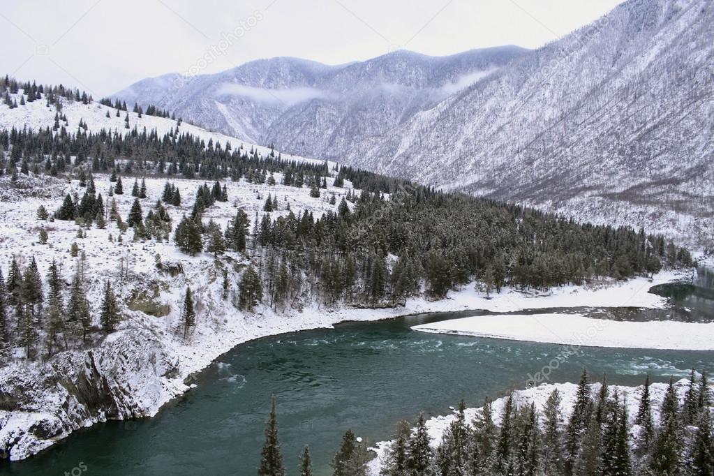 Turquoise Katun River in winter