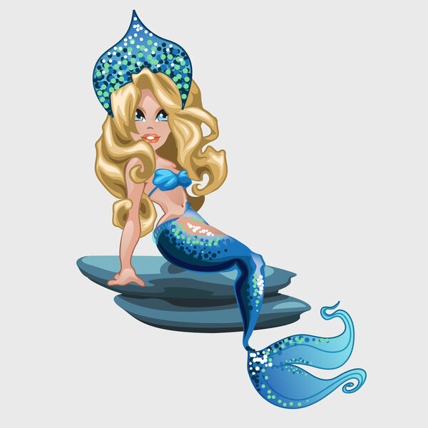 Mermaid in blue resting on the stone