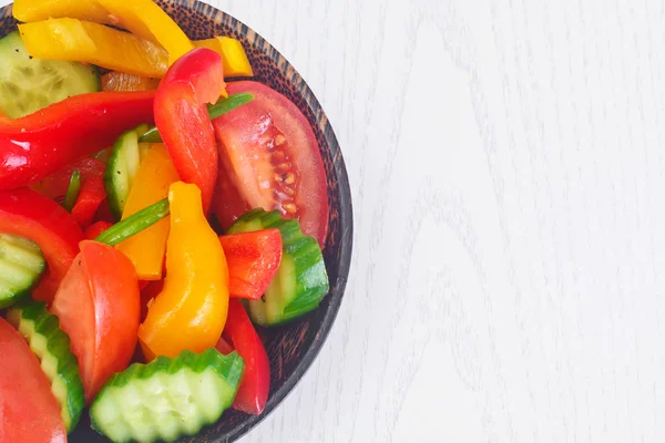 Healthy and diet food: Lettuce, tomato, pepper, seeds, oil, salt