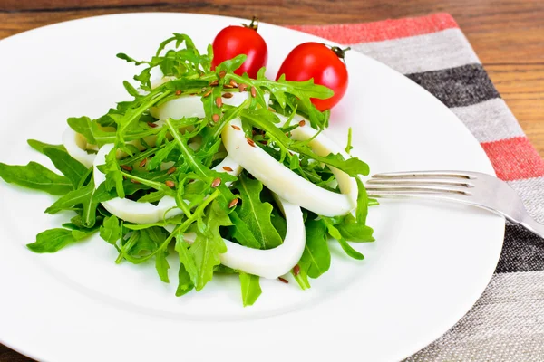 Arugula Salad with Squid, Flax Seeds, Olives and Cherry Tomatoes