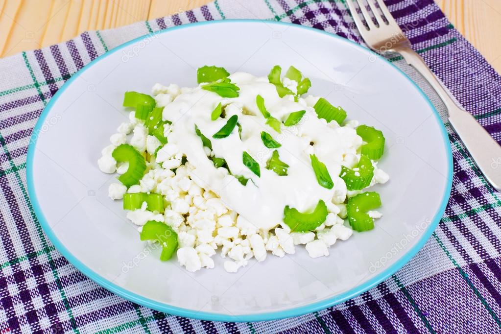 Dietary Dish Of Granulated Cottage Cheese And Celery Stock Photo