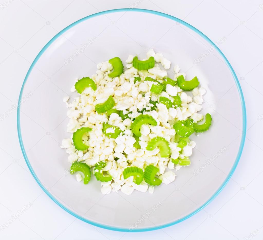 Dietary Dish Of Granulated Cottage Cheese And Celery Stock Photo