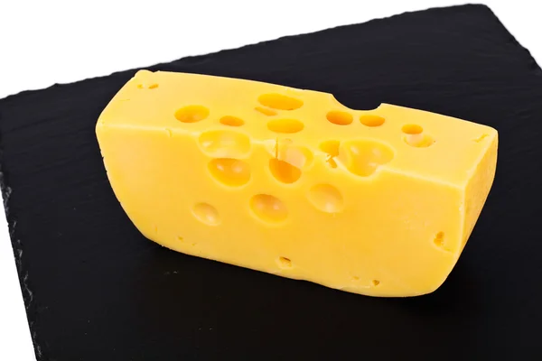 검은 배경에 스위스 치즈 — 스톡 사진