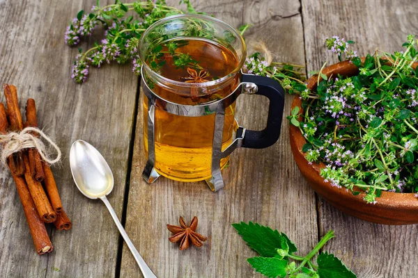 Herbal Tea with Thyme, Mint and Cinnamon on Wooden Rustic Backgr — Stock Photo, Image