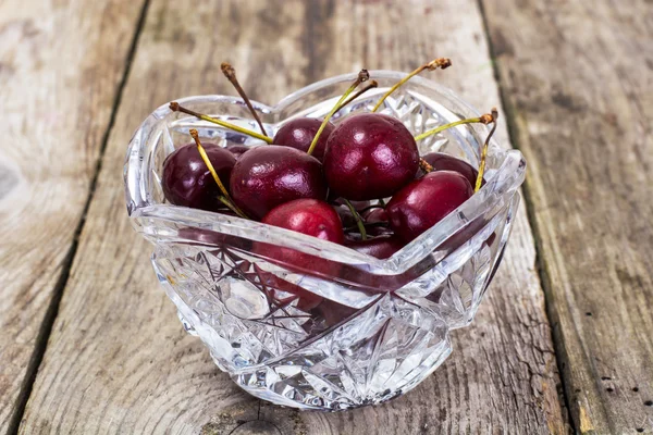 Cherries in Crystal Bowl on Rustic Background