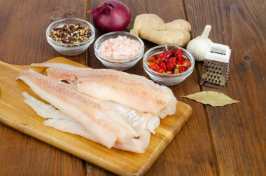 Frozen pollock fillet. Cooking fish dishes. Photo clipart