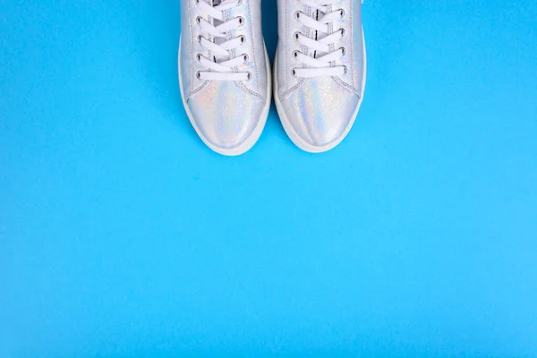 Silver Sneakers Blue Background Place Text Studio Photo — Stock Photo, Image