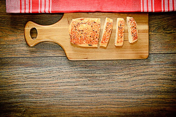 Sliced Bread with Sesame Seeds on a Wooden Board — Stock Photo, Image