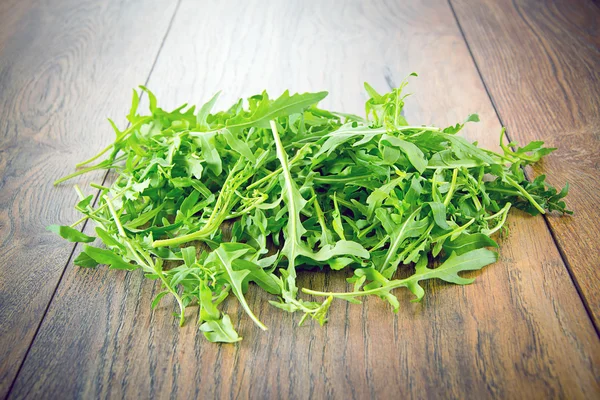 Arugula on Dark Woody Background — Stock Photo, Image