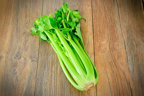 Fresh Juicy Celery on Woody Background — Stock Photo, Image