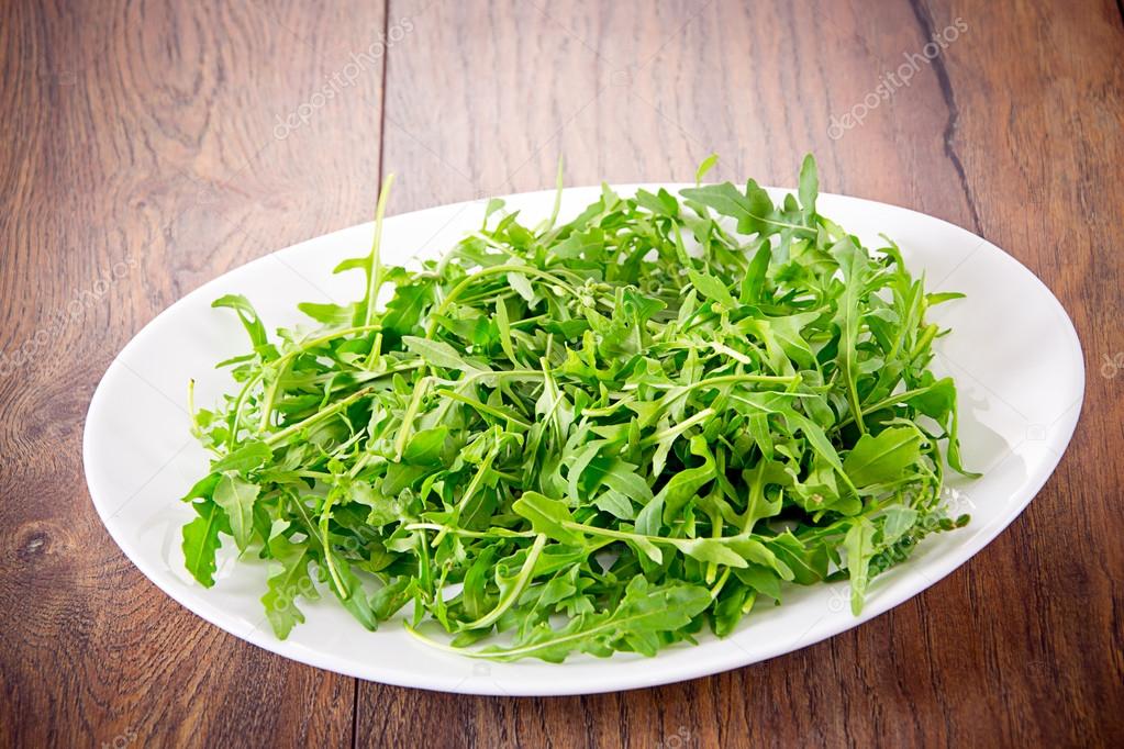 Arugula on Dark Woody Background