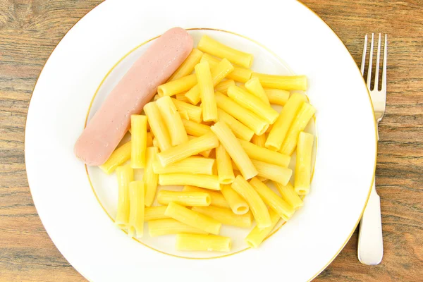 Eating Fast Food: Pasta with Sausage on Plate. — Stock Photo, Image